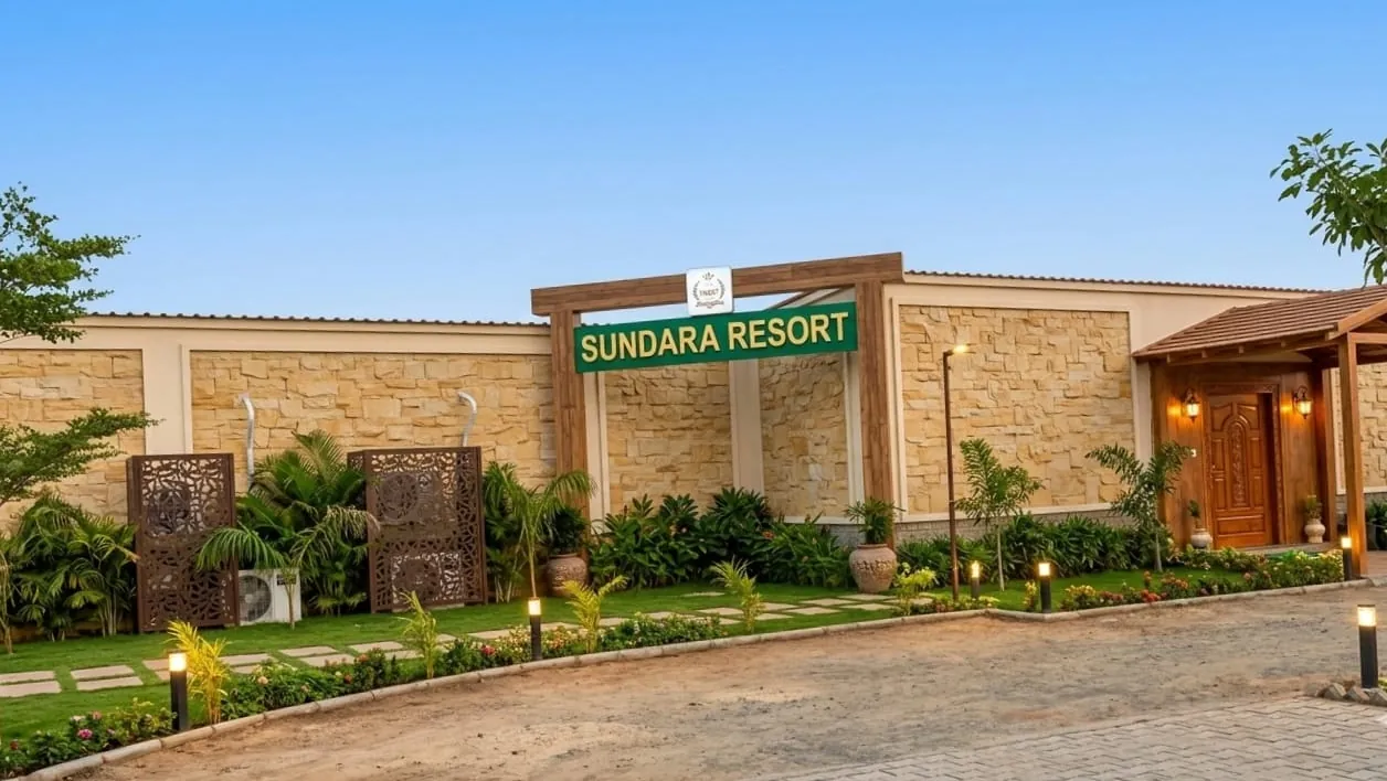 Sundara Resort gate with green signboard